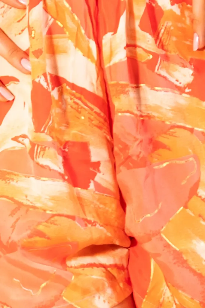 enterizo-corto-naranja-detalle.webp
