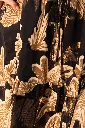 vestido-corto-volado-negro-detalle.webp
